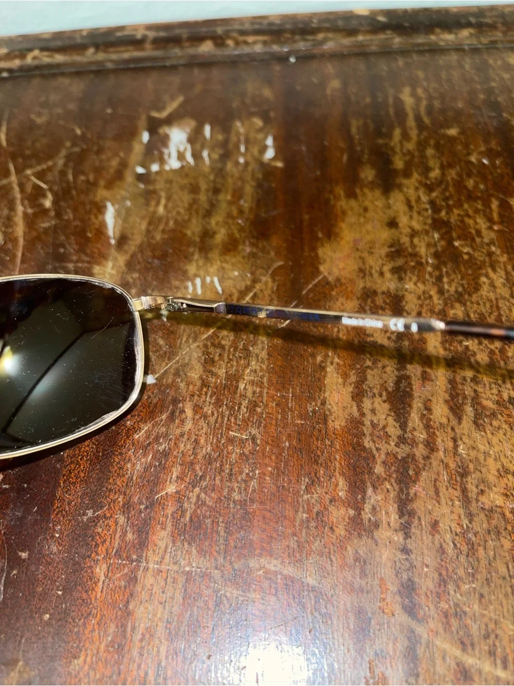 Tommy Hilfiger Men's Gold Frame Sunglasses with Dark Lenses